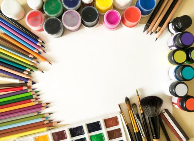 modulor berlin - Creative flat lay of colorful art supplies including paints, pencils, and brushes o