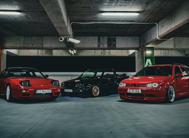 sh tuning - A group of three stylish sports cars parked under ambient lighting in an urban garage se