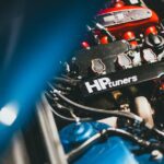 sh tuning - Dynamic close-up of a modern car engine featuring HP Tuners branding, showcasing automot