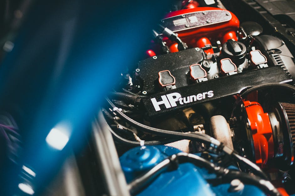 sh tuning - Dynamic close-up of a modern car engine featuring HP Tuners branding, showcasing automot